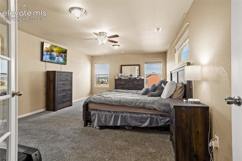 Image 12 of 30: Recessed ceiling lights, ceiling fan, and multiple windows