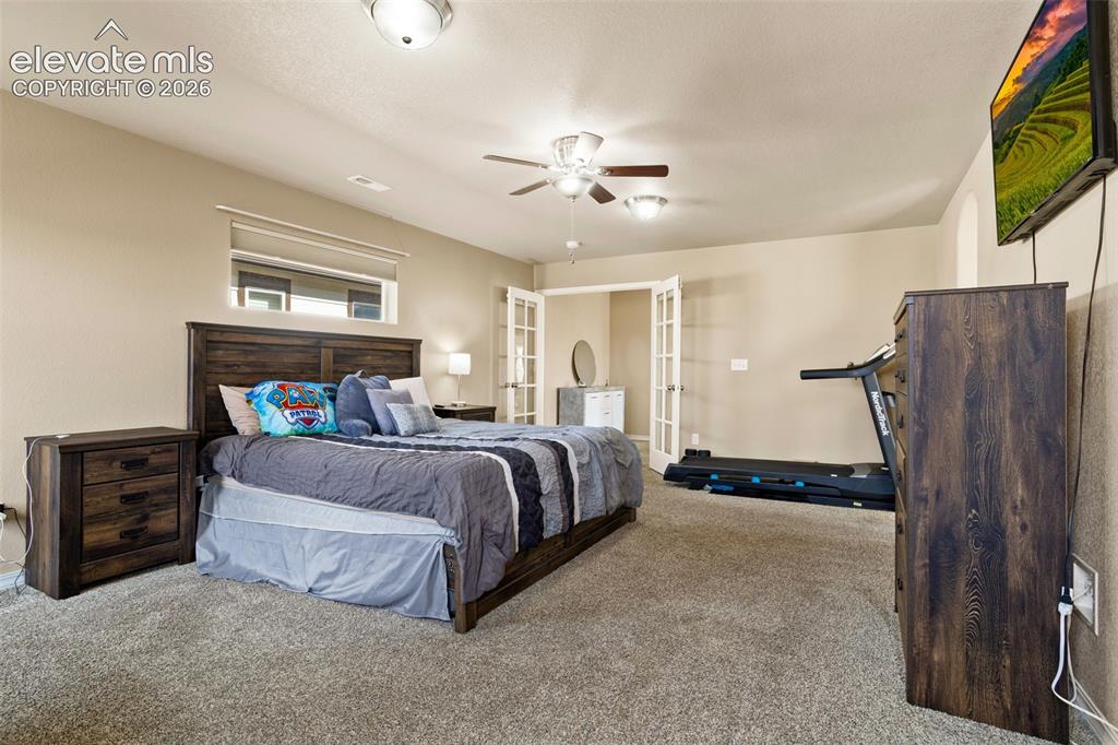 Image 13 of 30: Room featuring neutral wall tones, carpet flooring, a ceiling fan with inte