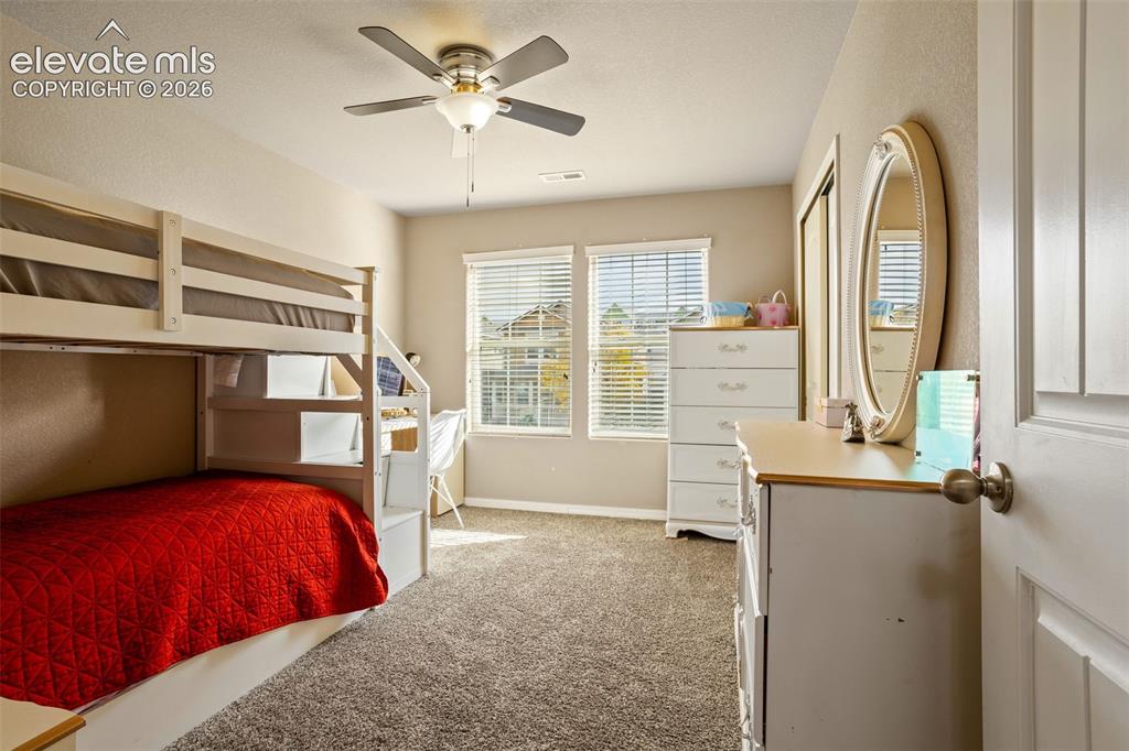 Image 17 of 30: Wall-to-wall carpeting and neutral wall tones