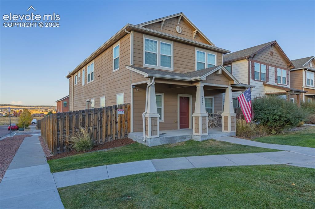 Image 2 of 30: Two-story exterior with neutral siding