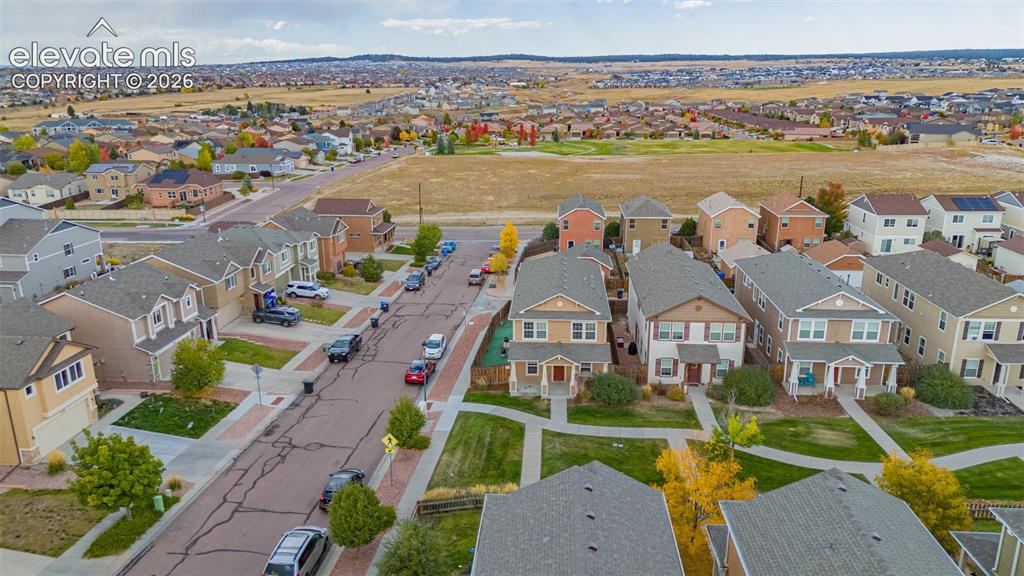 Image 29 of 30: Residential neighborhood with varied architectural styles and established l