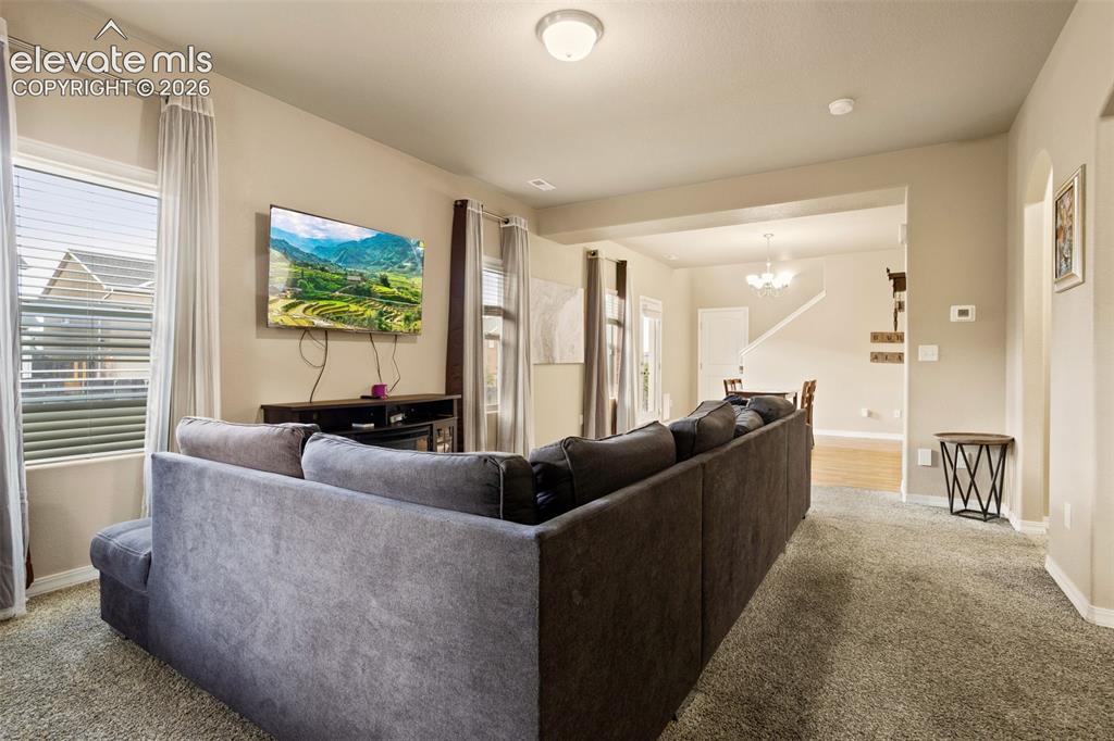 Image 4 of 30: Recessed lighting and ceiling-mounted light fixtures illuminate the space