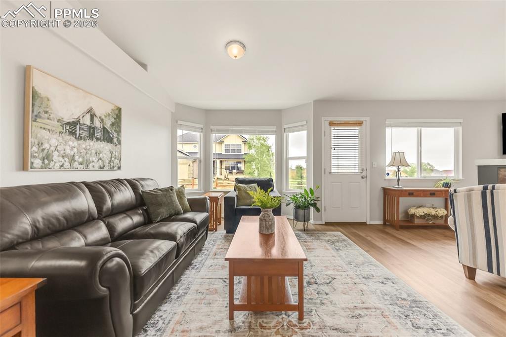 Image 12 of 43: Sitting area in great room could be used as a dining room