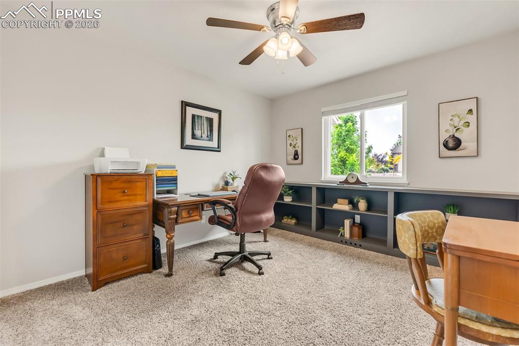 Image 26 of 43: 3rd Main level bedroom with built ins being used as an office