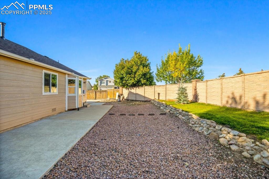 Image 17 of 27: View of fenced backyard