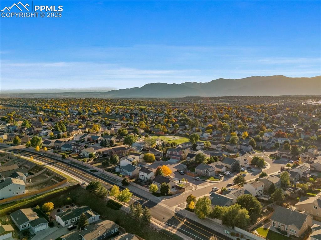 Image 26 of 27: View of property location with nearby suburban area and a mountain backdrop