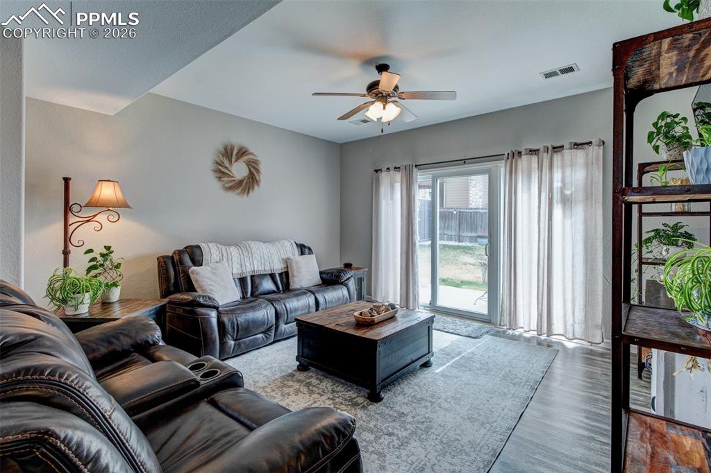 Image 12 of 32: Family room with big slider to exterior 11