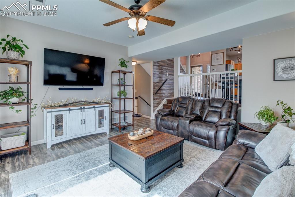 Image 13 of 32: Family room opens to dining and kitchen area