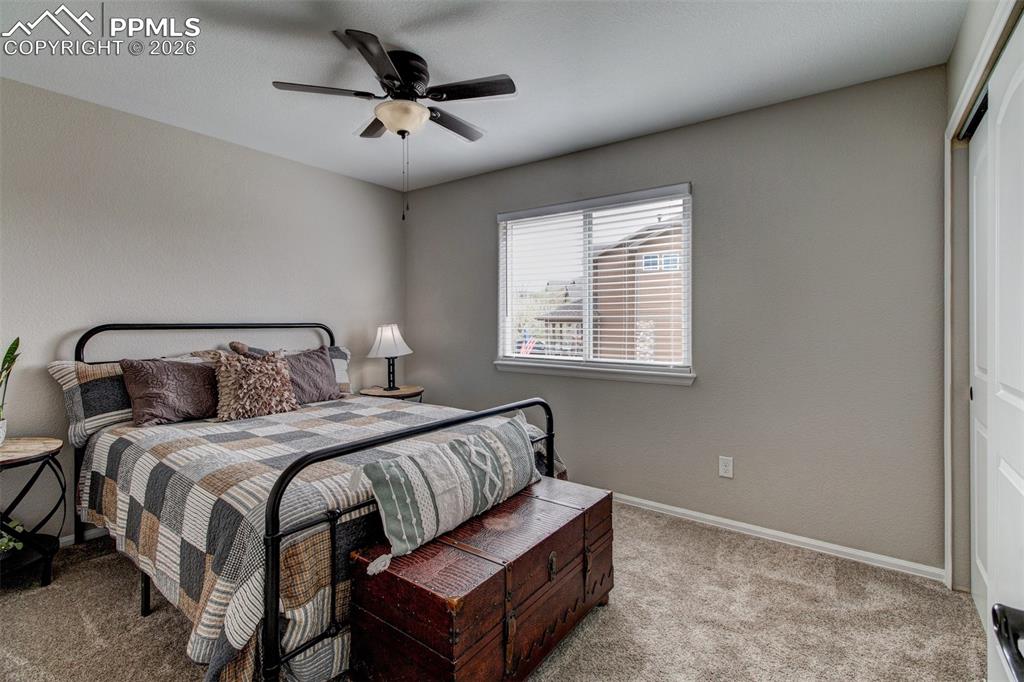 Image 21 of 32: Upper level guest bedroom