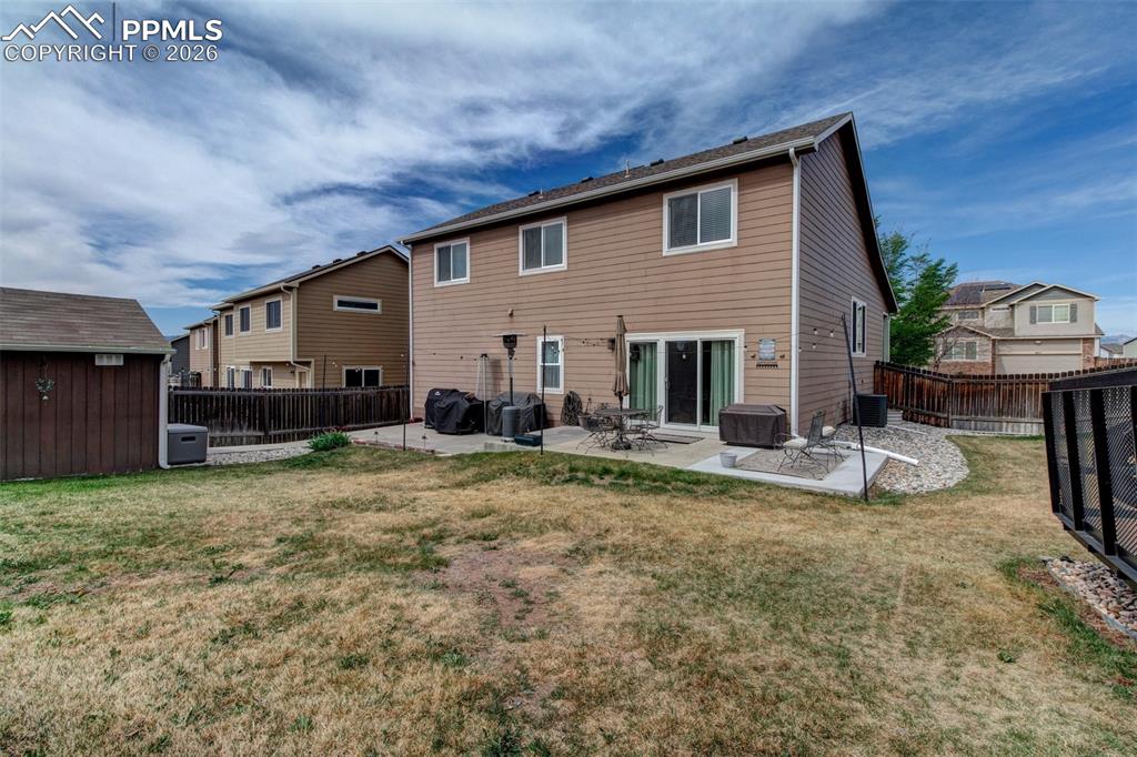 Image 26 of 32: Back of home showing the 11