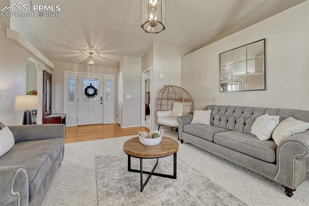 Image 11 of 42: The living room is gracious and welcoming with it