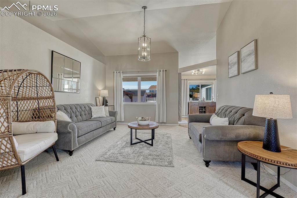 Image 12 of 42: Refreshed finishes throughout the home give the living room a cohesive, upd