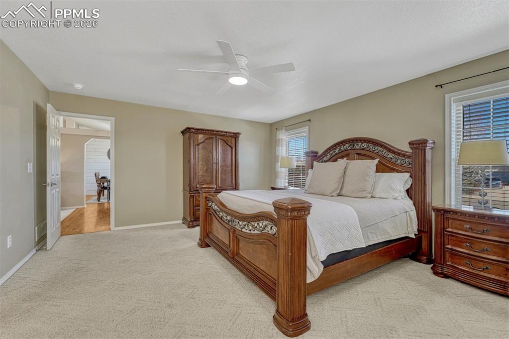 Image 20 of 42: Main level primary is at the front of the house with soft, east facing ligh