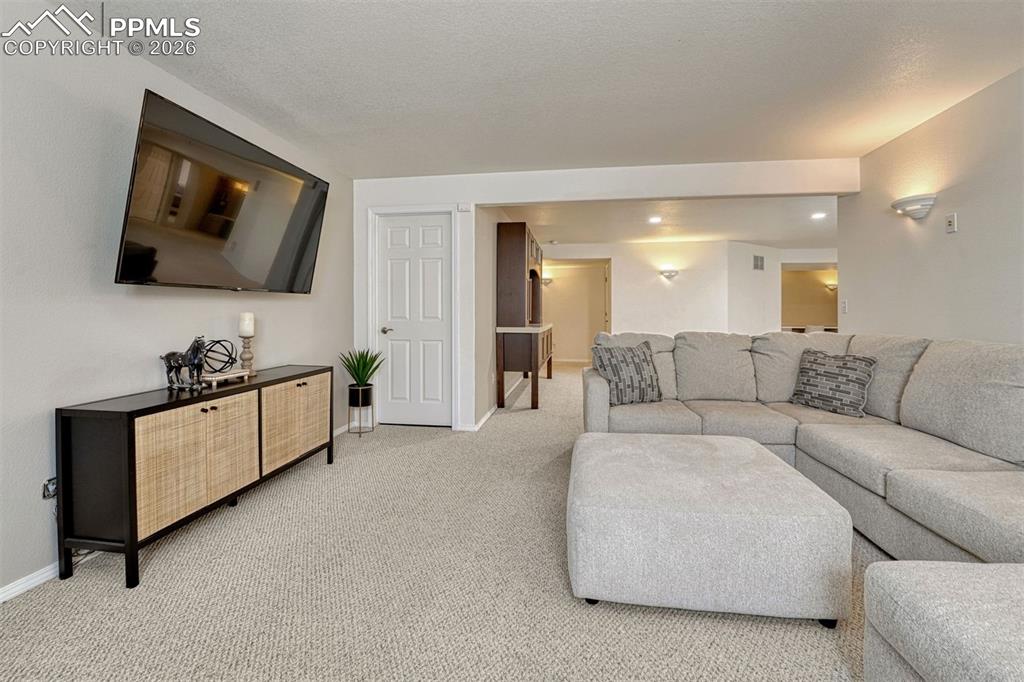 Image 26 of 42: While storage is abundant throughout the home, the understairs area offers