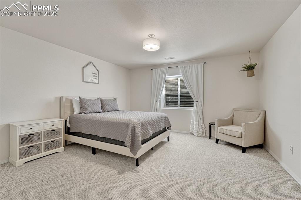 Image 31 of 42: Downstairs bedroom