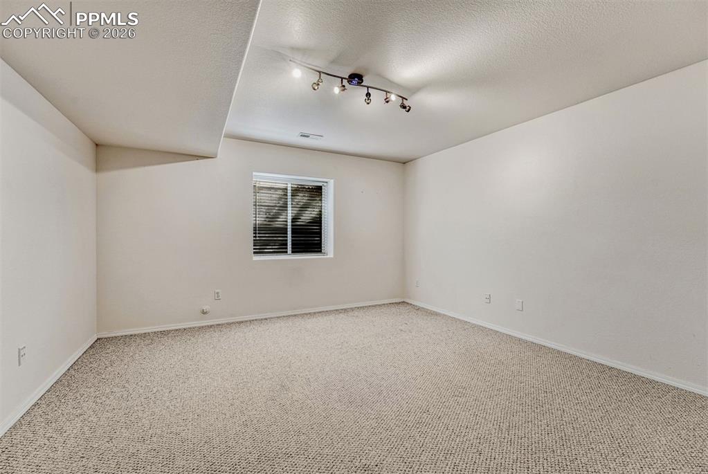 Image 34 of 42: Downstairs bedroom