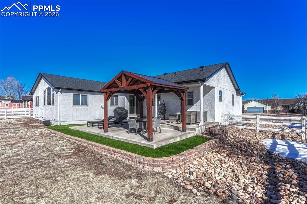 Image 37 of 42: The back yard is fully fenced