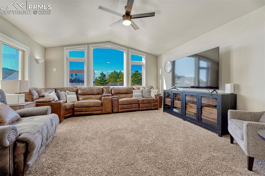 Image 4 of 42: With abundant natural light, the family room is conveniently near the kitch