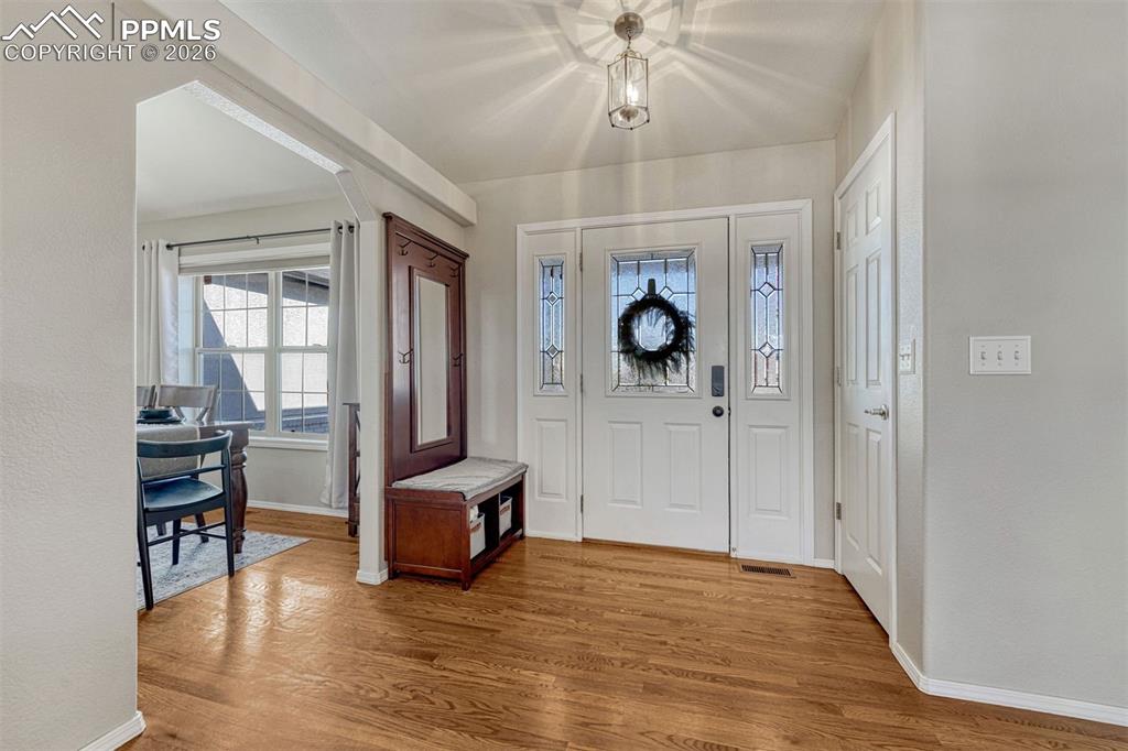 Image 8 of 42: From the moment you walk in, the hardwood floors and bright open spaces are
