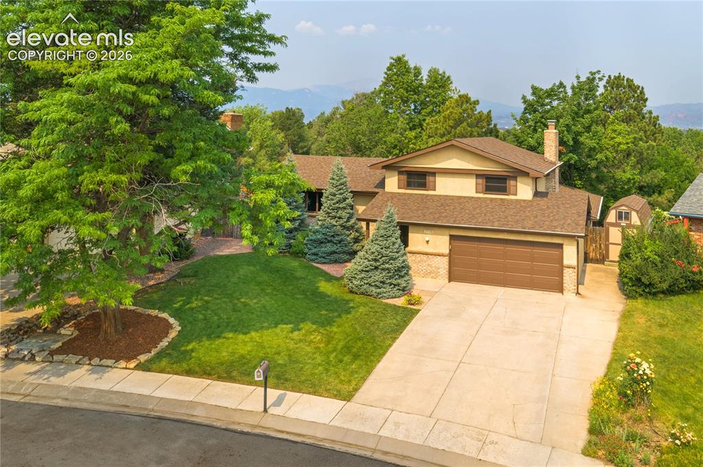 Image 1 of 50: Stucco and brick 4-bed, 3-bath, 2-car garage on a beautiful, mature treed .