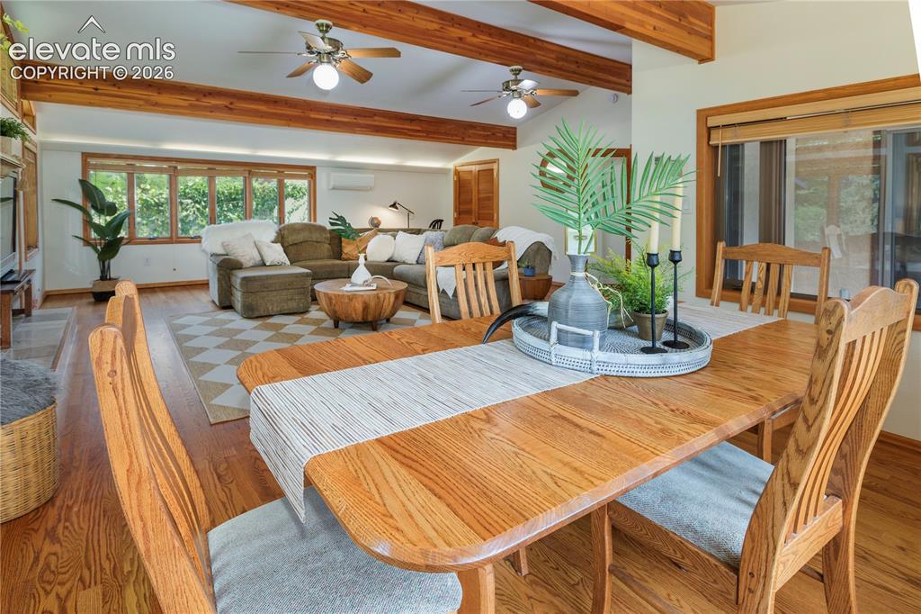 Image 10 of 50: Dining area featuring a wood-finish table, wood-finish flooring, and recess