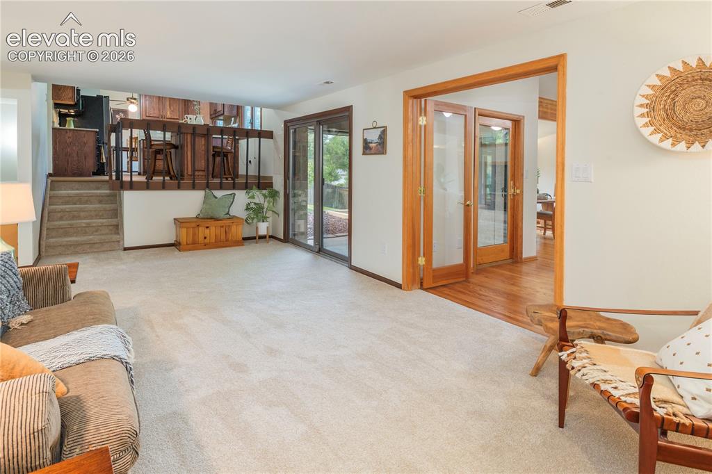 Image 15 of 50: Walk-out slider offers access to back patio and yard.