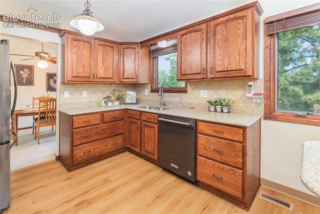 Image 25 of 50: Kitchen Aid dishwasher and double stainless steel sink with new gooseneck f