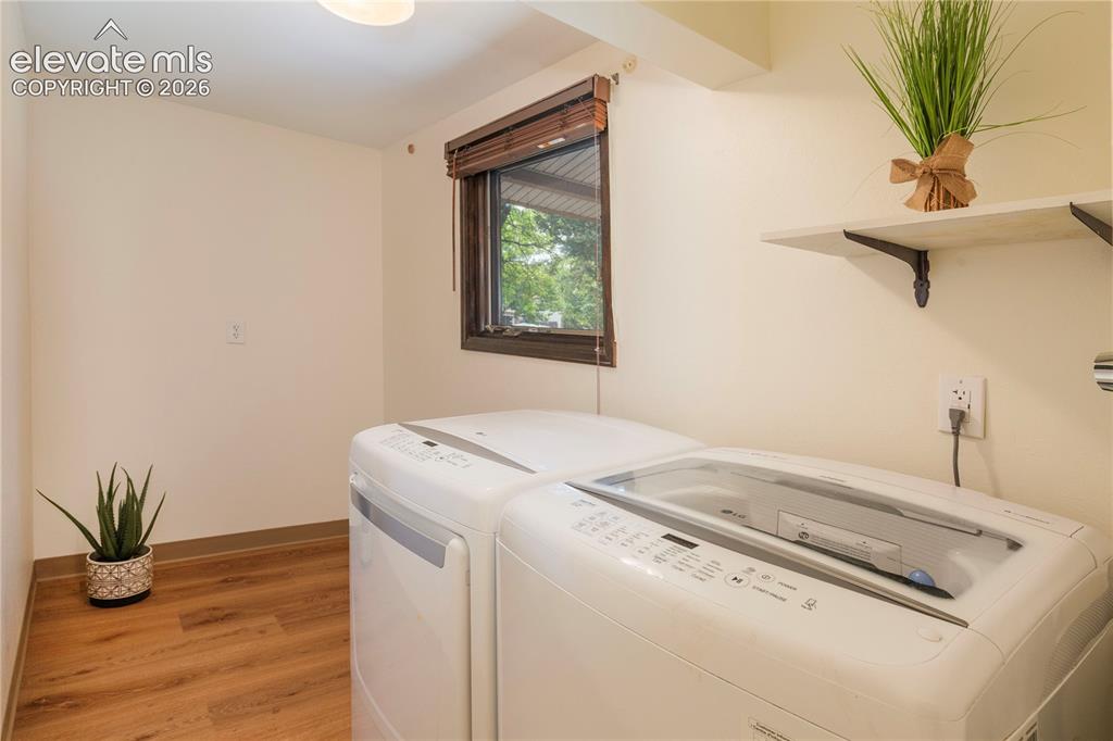 Image 41 of 50: Laundry room on main with washer, dryer, window and plenty of room for addi