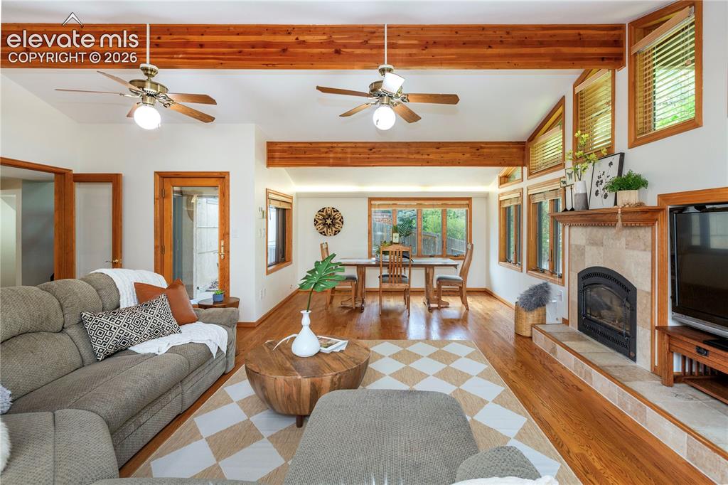 Image 8 of 50: Ceiling fans and thermostat-controlled gas fireplace with an integrated med
