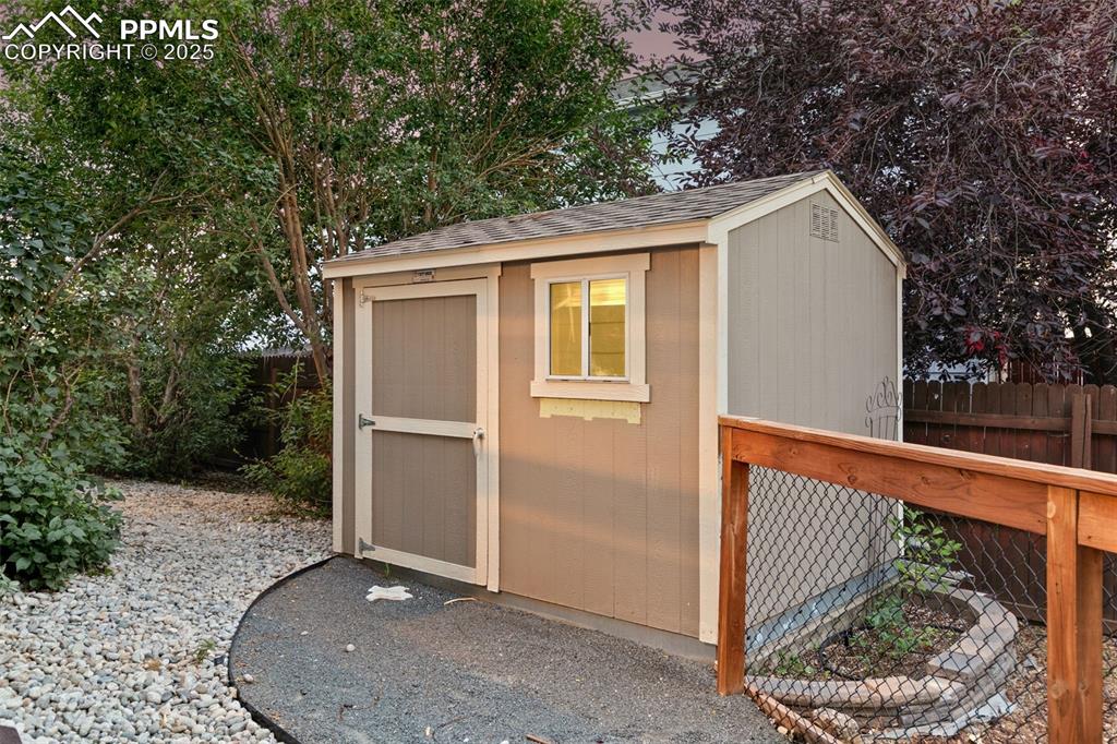 Image 46 of 50: Storage shed in backyard