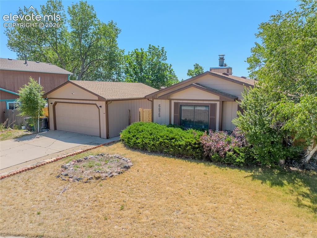 Image 1 of 31: Single-story residence featuring a two-car garage with a concrete driveway