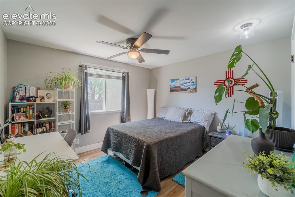 Image 19 of 31: Spacious room featuring wood-finish flooring, a window offering natural lig