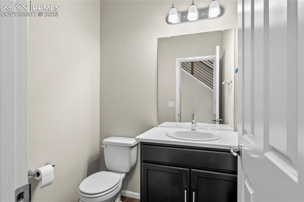 Image 11 of 43: Half bath with a vanity on main level