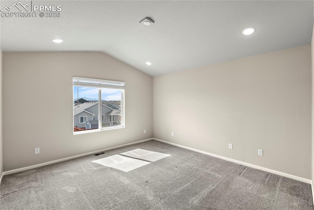 Image 13 of 43: Large Primary Suite with soft carpets, recessed lighting and en suite bathr