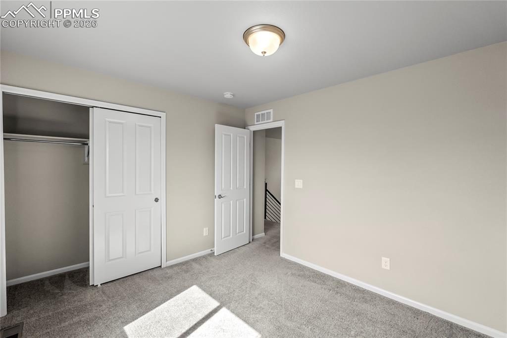 Image 26 of 43: Upper Level Bedroom