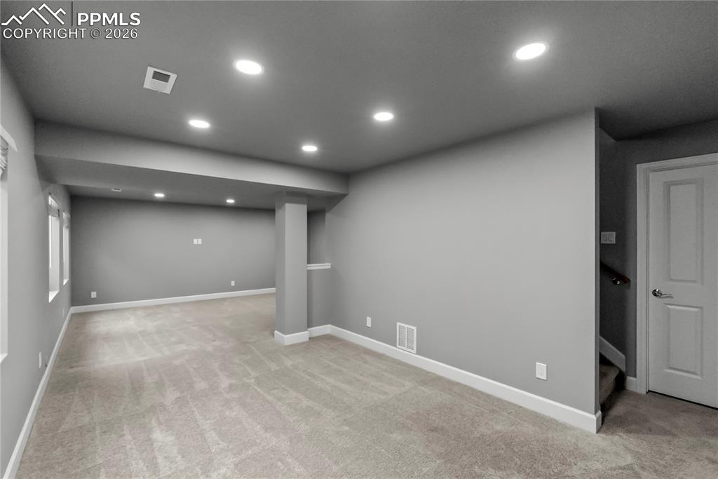 Image 28 of 43: Finished Basement with recessed lighting, soft carpet which makes it the pe