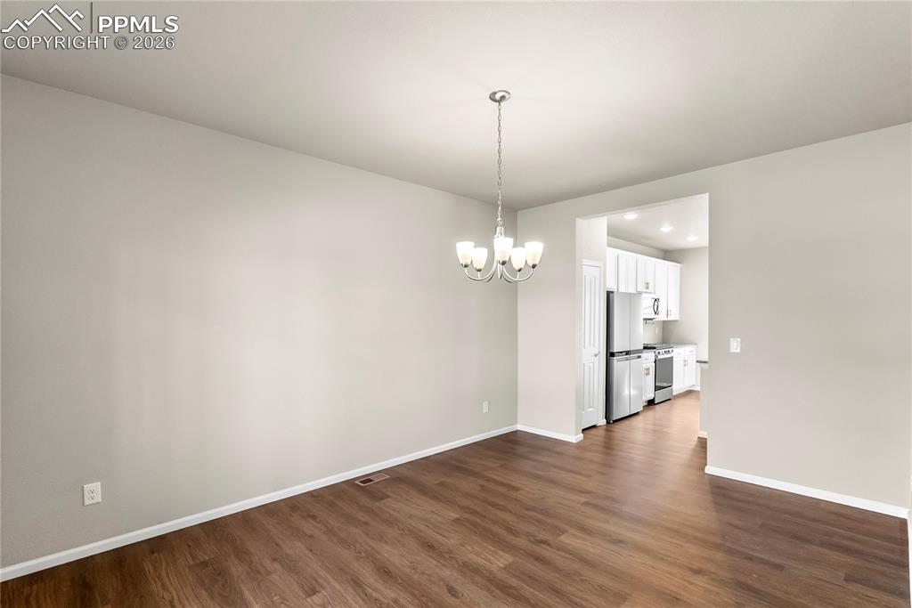 Image 5 of 43: Dining area with luxury vinyl plank floors