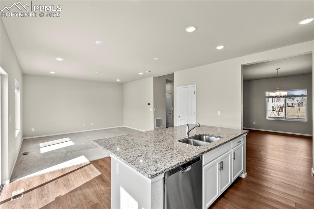 Image 9 of 43: Kitchen Island overlooking living room