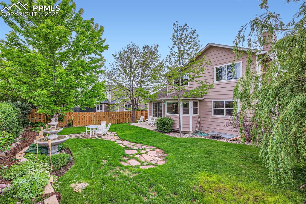 Image 18 of 18: View of yard featuring a patio area