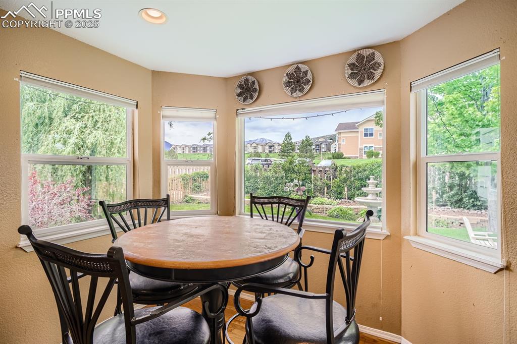 Image 5 of 18: Dining room with plenty of natural light, a textured wall, and recessed lig