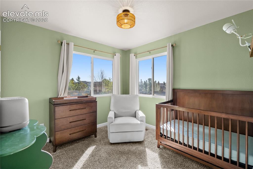 Image 14 of 42: Room featuring two windows, recessed lighting, and soft green walls