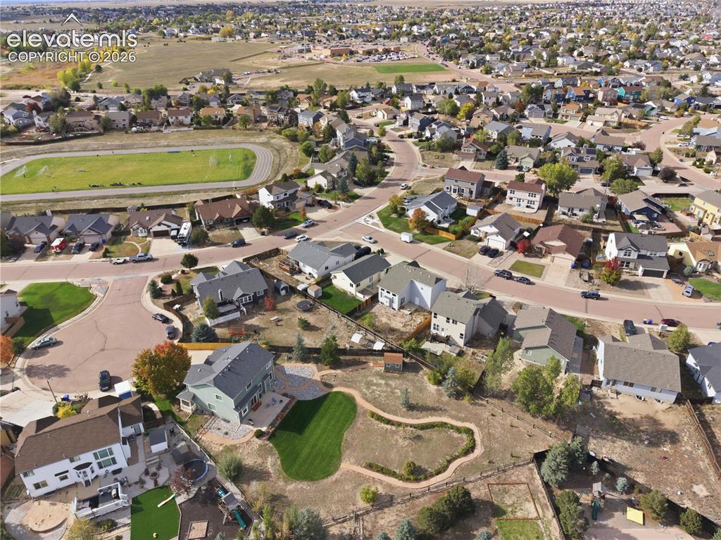 Image 40 of 42: Expansive neighborhood featuring residential homes, paved streets, and a gr