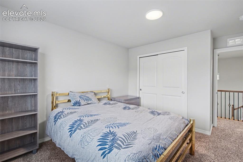 Image 29 of 43: Recessed ceiling lighting, white interior walls, bi-fold closet doors, and