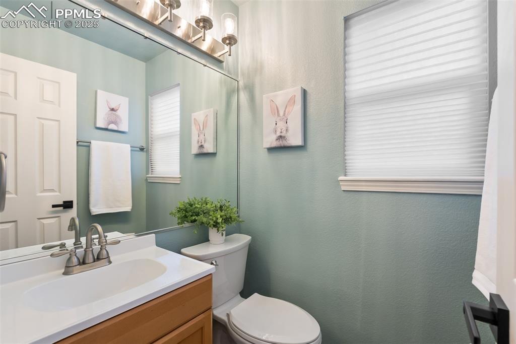 Image 35 of 50: Bathroom featuring vanity and a textured wall