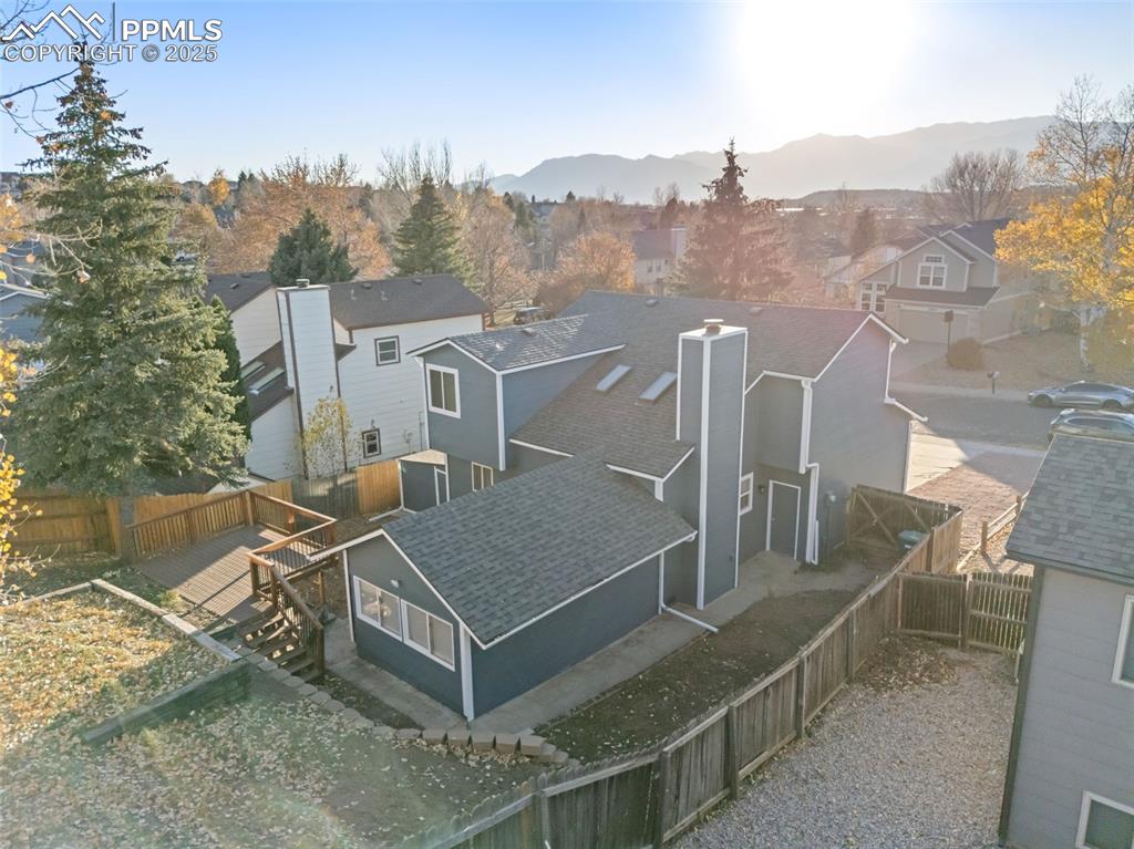 Image 48 of 50: Aerial perspective of suburban area with a mountainous background
