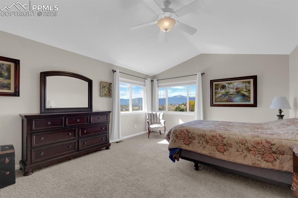 Image 17 of 43: Primary Bedroom with amazing Pikes Peak view
