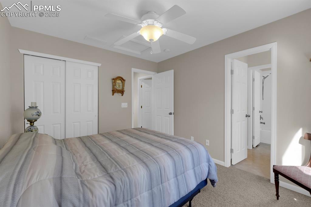 Image 24 of 43: Bedroom 2 with entry to bathroom