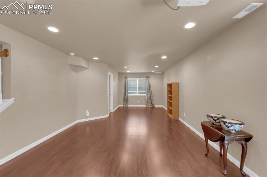 Image 28 of 43: Family Room with Recessed Lighting