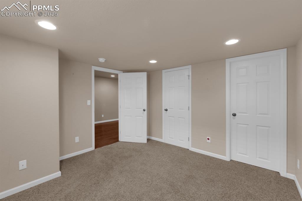 Image 32 of 43: Basement Bedroom with walk-in closet