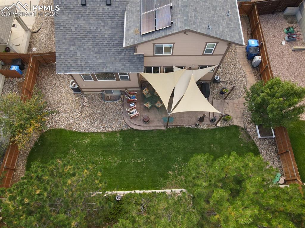 Image 36 of 43: View from above property featuring shade sails over patio 